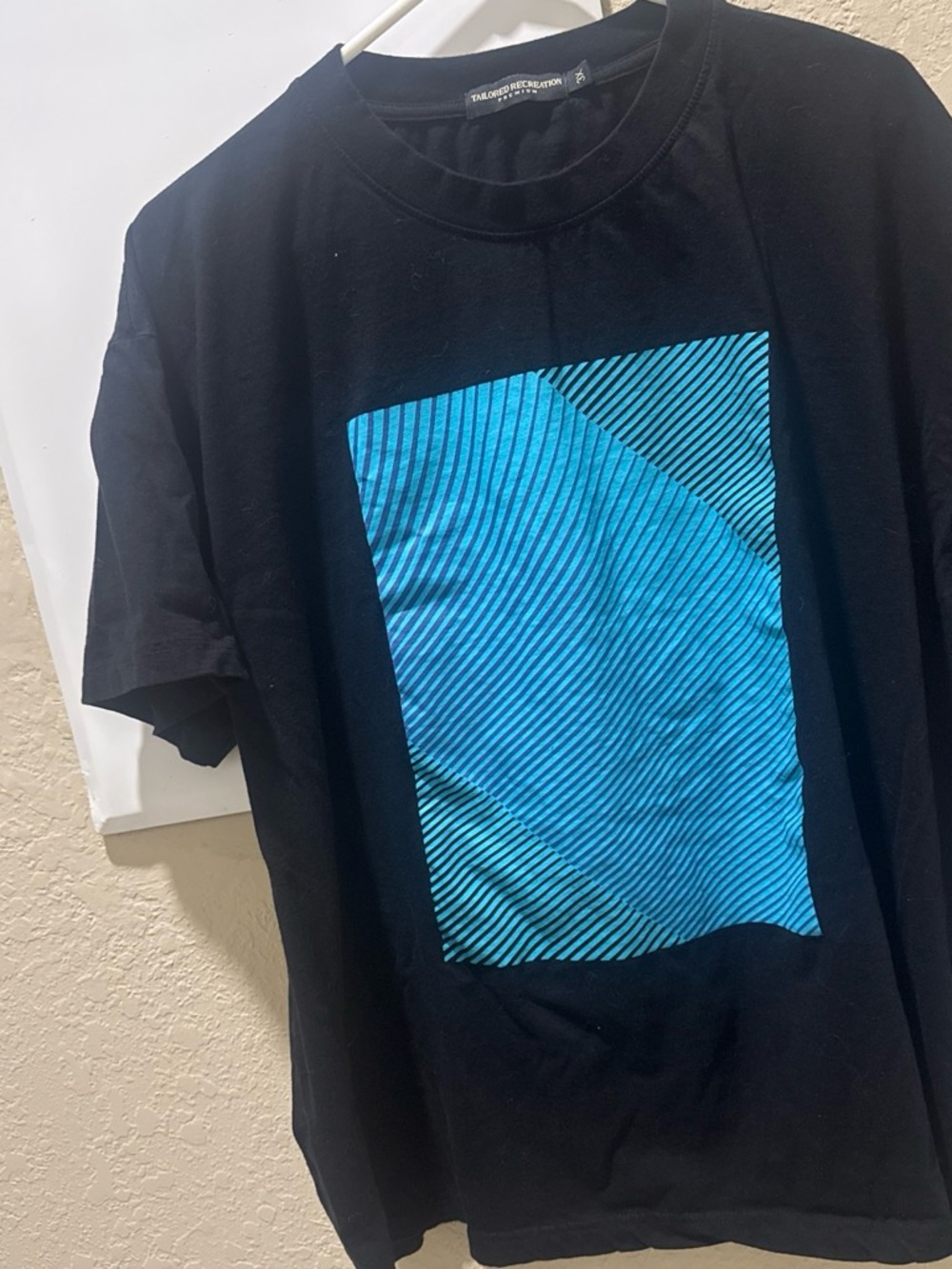 Men's Black Graphic Tee with Blue Panel